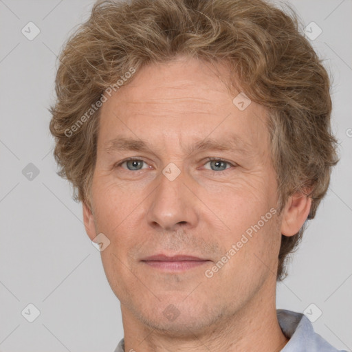 Joyful white adult male with short  brown hair and grey eyes