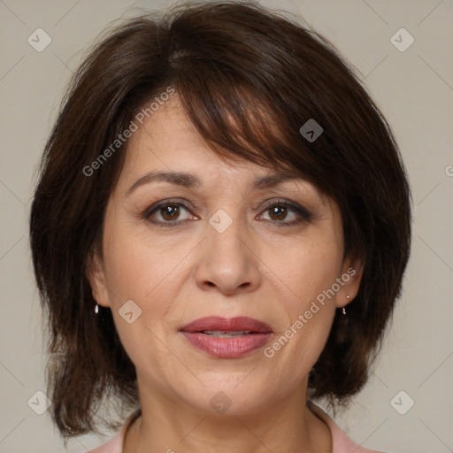 Joyful white adult female with medium  brown hair and brown eyes