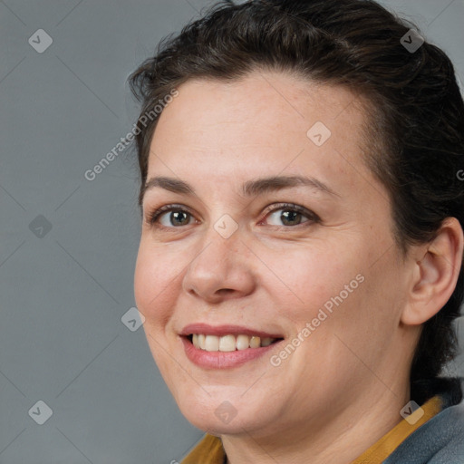 Joyful white adult female with medium  brown hair and brown eyes