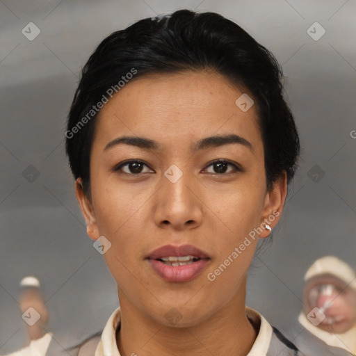 Joyful asian young-adult female with short  black hair and brown eyes