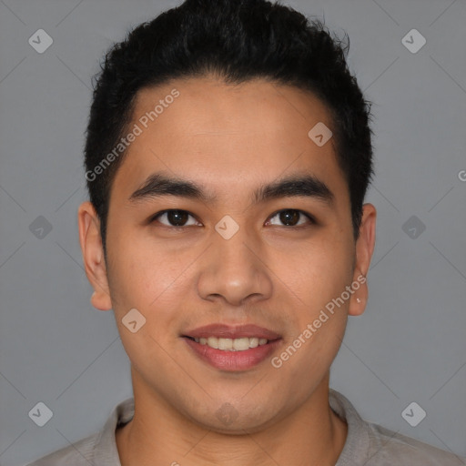 Joyful latino young-adult male with short  brown hair and brown eyes