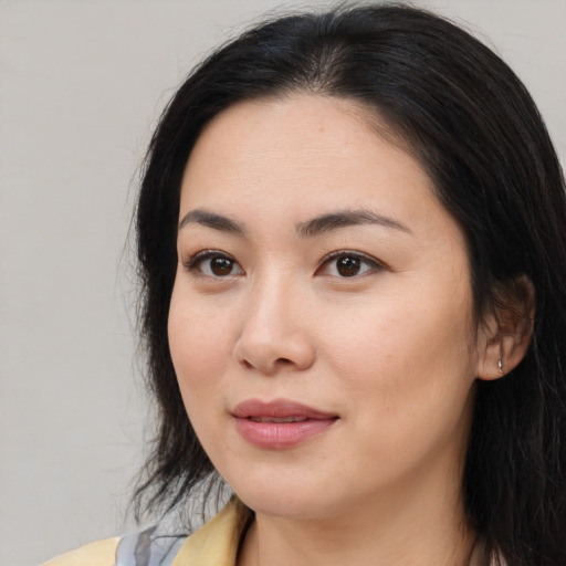 Neutral asian young-adult female with long  brown hair and brown eyes