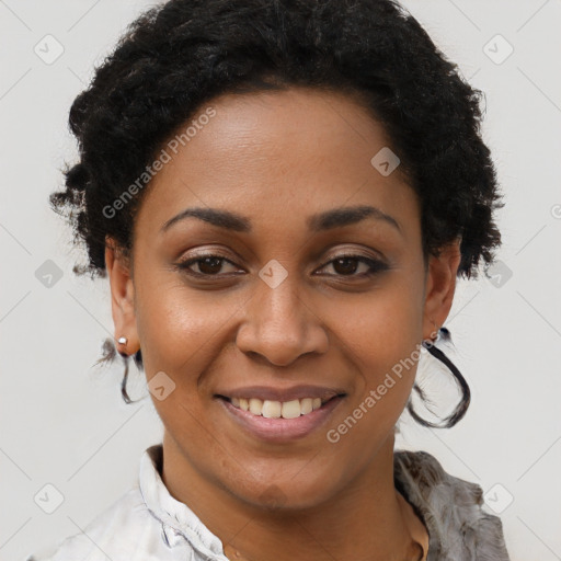 Joyful black young-adult female with short  black hair and brown eyes