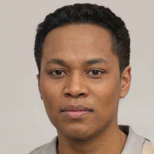 Neutral black young-adult male with short  black hair and brown eyes
