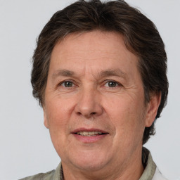 Joyful white middle-aged male with short  brown hair and brown eyes