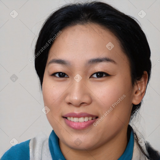 Joyful asian young-adult female with medium  black hair and brown eyes