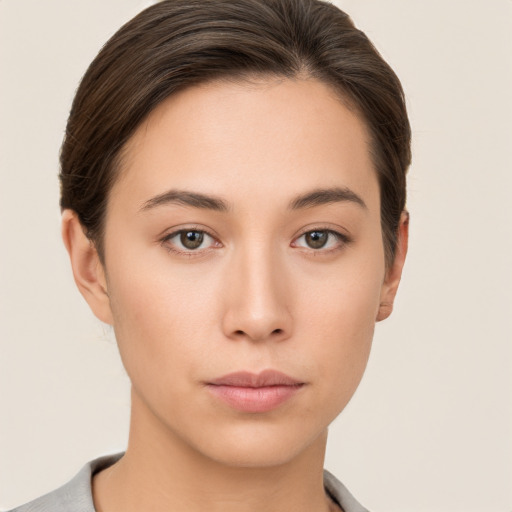 Neutral white young-adult female with short  brown hair and brown eyes