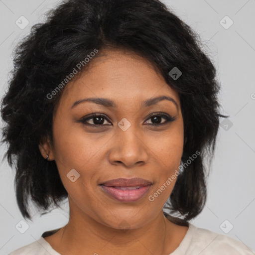 Joyful black adult female with medium  brown hair and brown eyes