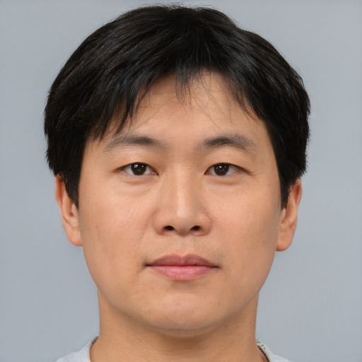 Neutral asian young-adult male with short  brown hair and brown eyes