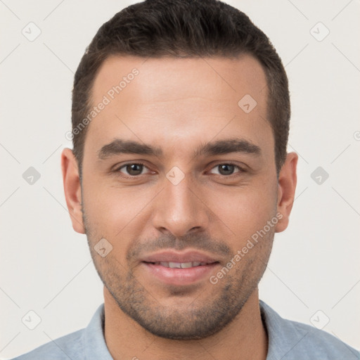 Joyful white young-adult male with short  brown hair and brown eyes