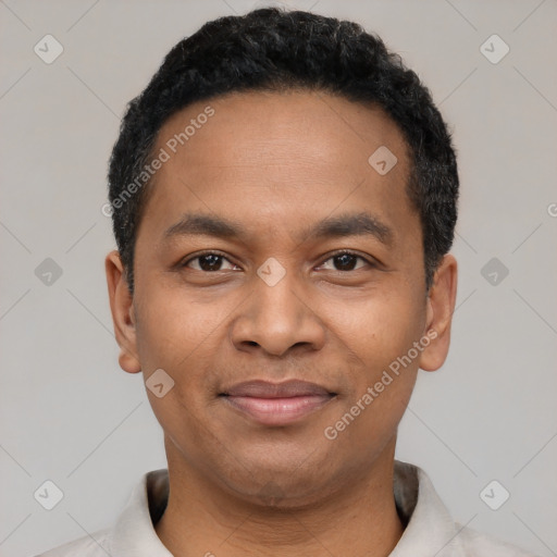 Joyful black young-adult male with short  black hair and brown eyes