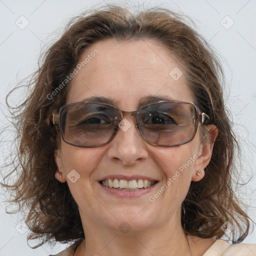 Joyful white adult female with medium  brown hair and blue eyes