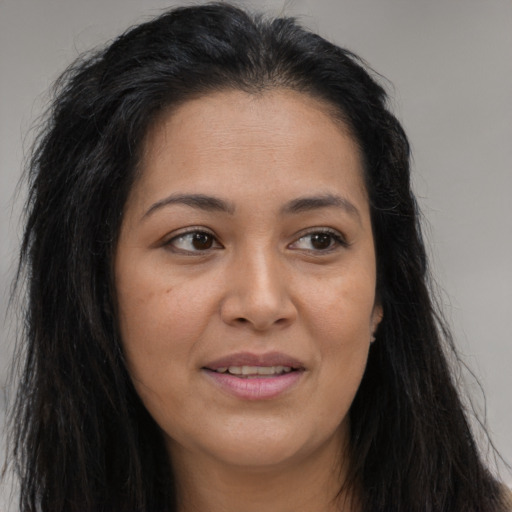 Joyful asian young-adult female with long  brown hair and brown eyes