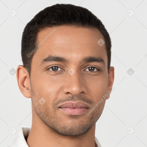 Joyful latino young-adult male with short  brown hair and brown eyes