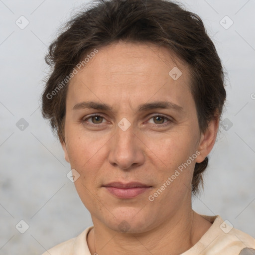 Joyful white adult female with short  brown hair and brown eyes