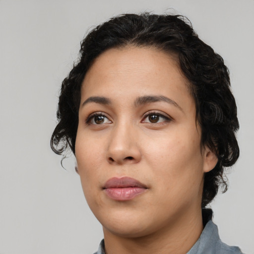 Neutral latino young-adult female with medium  black hair and brown eyes