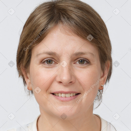 Joyful white adult female with medium  brown hair and grey eyes