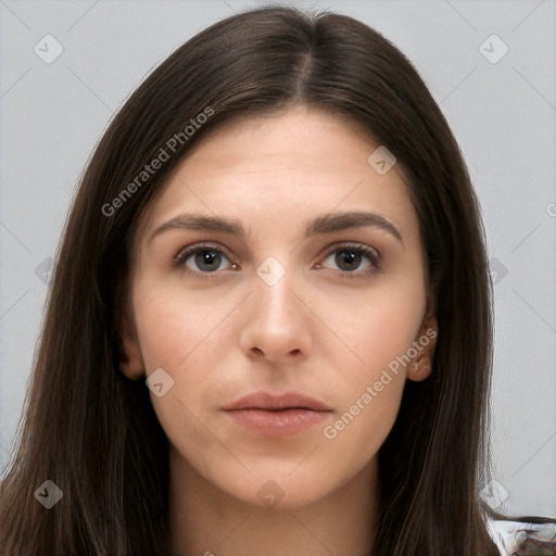 Neutral white young-adult female with long  brown hair and brown eyes