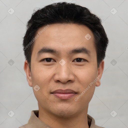 Joyful white young-adult male with short  black hair and brown eyes