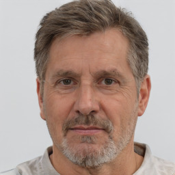 Neutral white middle-aged male with short  gray hair and brown eyes