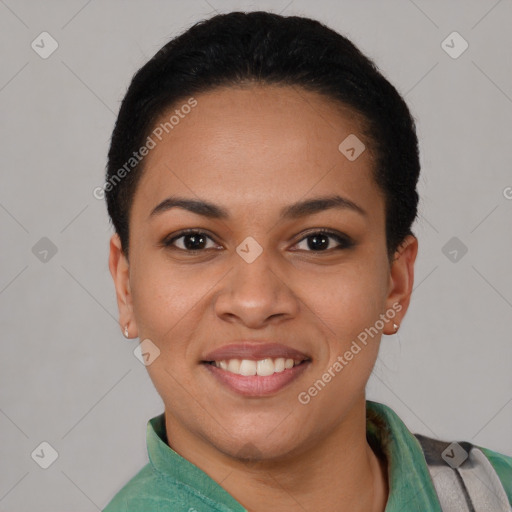 Joyful latino young-adult female with short  black hair and brown eyes