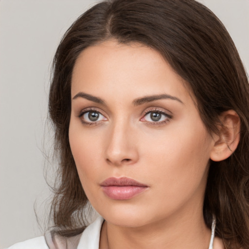 Neutral white young-adult female with medium  brown hair and brown eyes