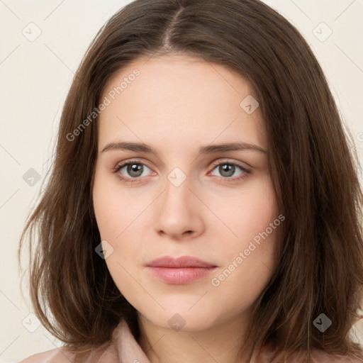 Neutral white young-adult female with long  brown hair and brown eyes