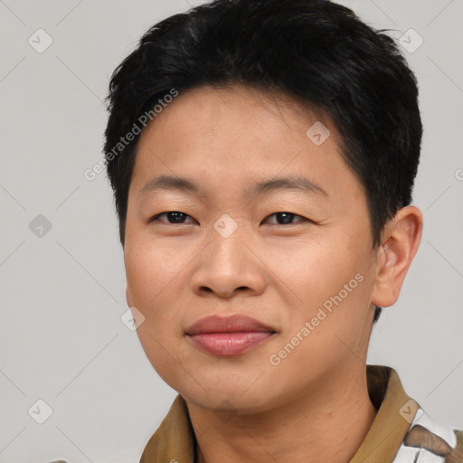 Joyful asian young-adult male with short  black hair and brown eyes