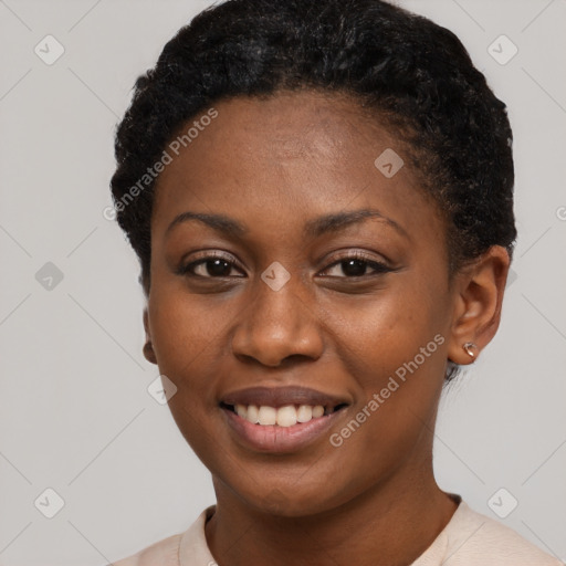 Joyful black young-adult female with short  black hair and brown eyes