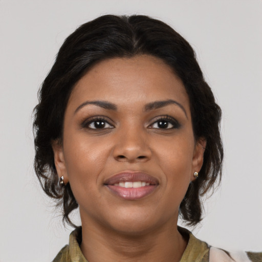 Joyful black young-adult female with medium  brown hair and brown eyes