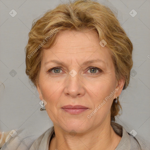 Joyful white adult female with medium  brown hair and blue eyes