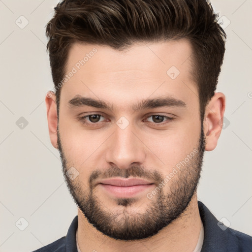 Joyful white young-adult male with short  brown hair and brown eyes