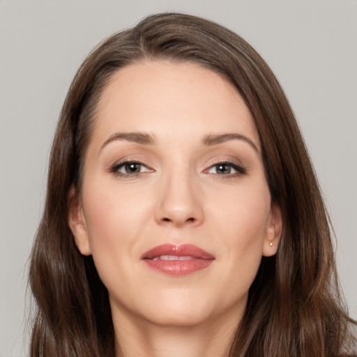 Joyful white young-adult female with long  brown hair and grey eyes