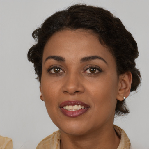 Joyful latino young-adult female with medium  brown hair and brown eyes