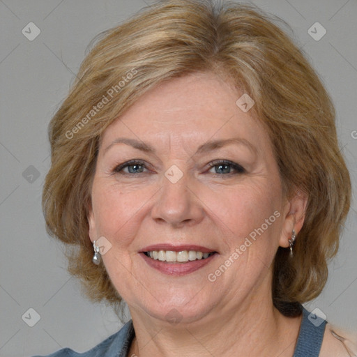 Joyful white adult female with medium  brown hair and blue eyes