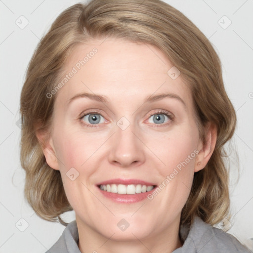 Joyful white adult female with medium  brown hair and blue eyes