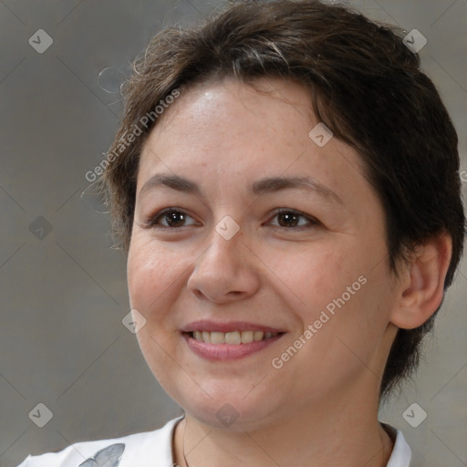 Joyful white adult female with short  brown hair and brown eyes