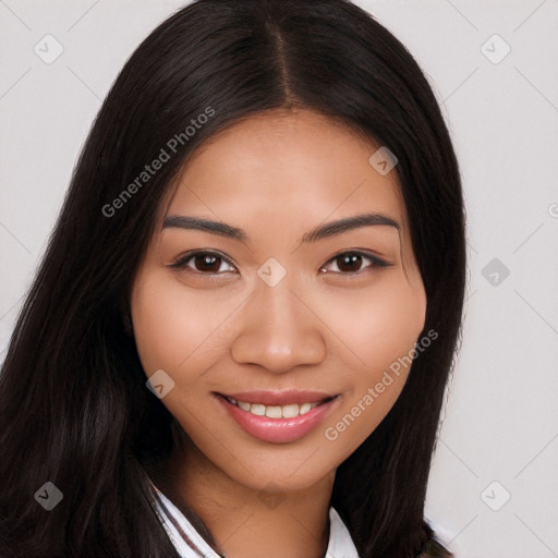 Joyful latino young-adult female with long  brown hair and brown eyes