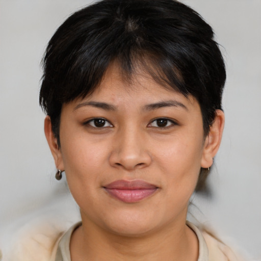 Joyful asian young-adult female with short  brown hair and brown eyes