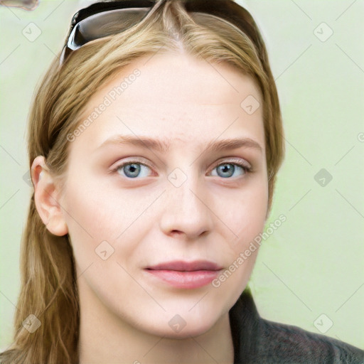 Neutral white young-adult female with long  brown hair and blue eyes