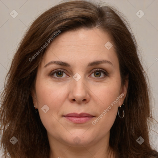 Joyful white adult female with long  brown hair and brown eyes