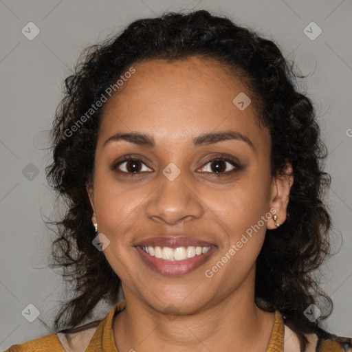 Joyful black young-adult female with long  brown hair and brown eyes