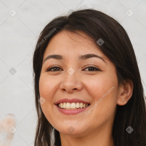 Joyful white young-adult female with long  brown hair and brown eyes