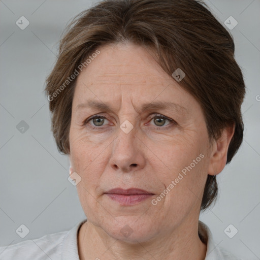 Joyful white adult female with short  brown hair and brown eyes