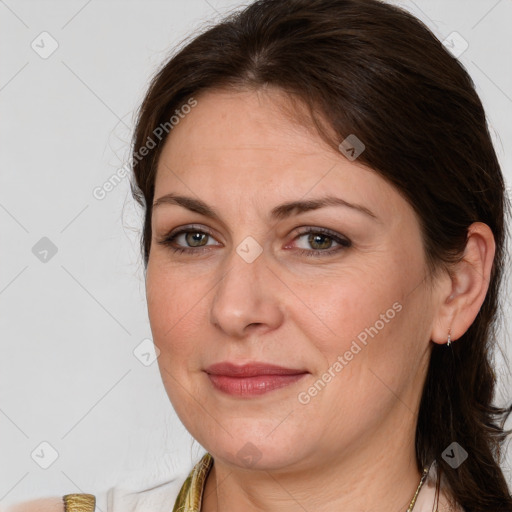 Joyful white adult female with medium  brown hair and brown eyes