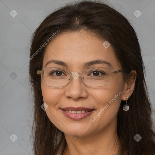 Joyful white adult female with long  brown hair and brown eyes