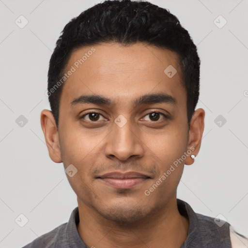 Joyful latino young-adult male with short  black hair and brown eyes