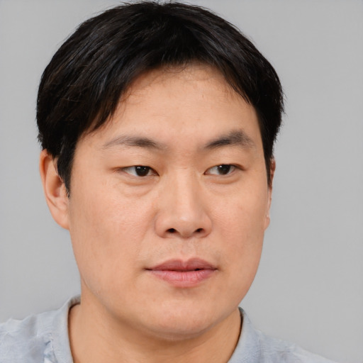 Neutral asian young-adult male with short  brown hair and brown eyes