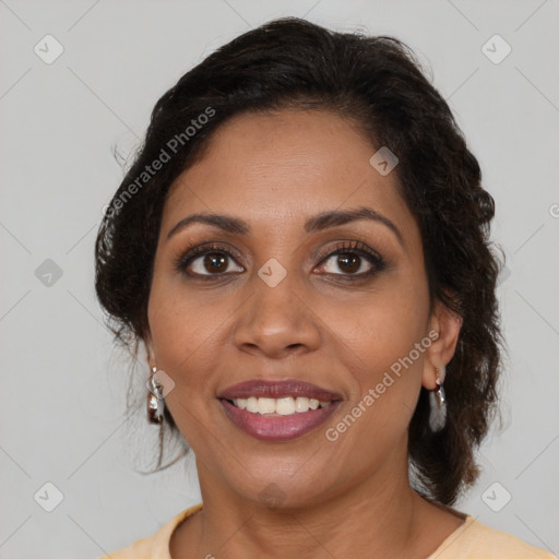 Joyful black adult female with medium  brown hair and brown eyes