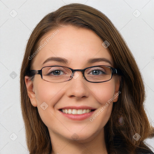 Joyful white young-adult female with long  brown hair and blue eyes